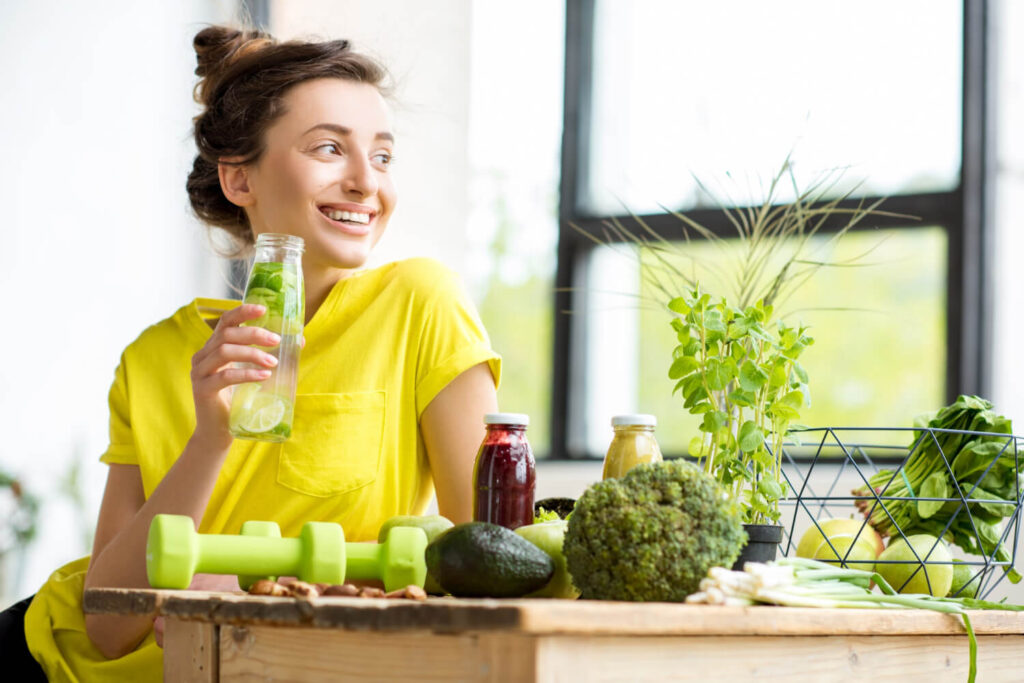 woman drinking water and eating healthy food