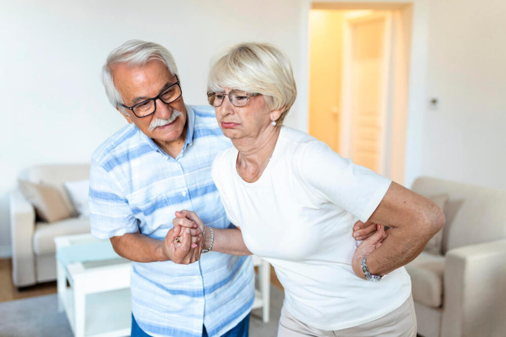 old couple managing osteoporosis symptoms
