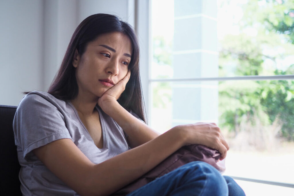 woman showing signs of loneliness and depressive state