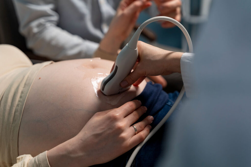 pregnant woman undergoing abdominal ultrasound