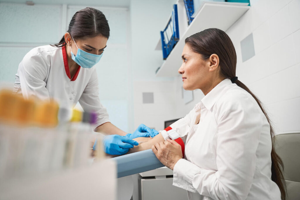 diabetic patient undergoing a blood extraction for a random blood sugar test