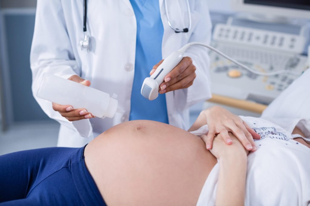 check up with an OBGYN due to pregnancy spotting