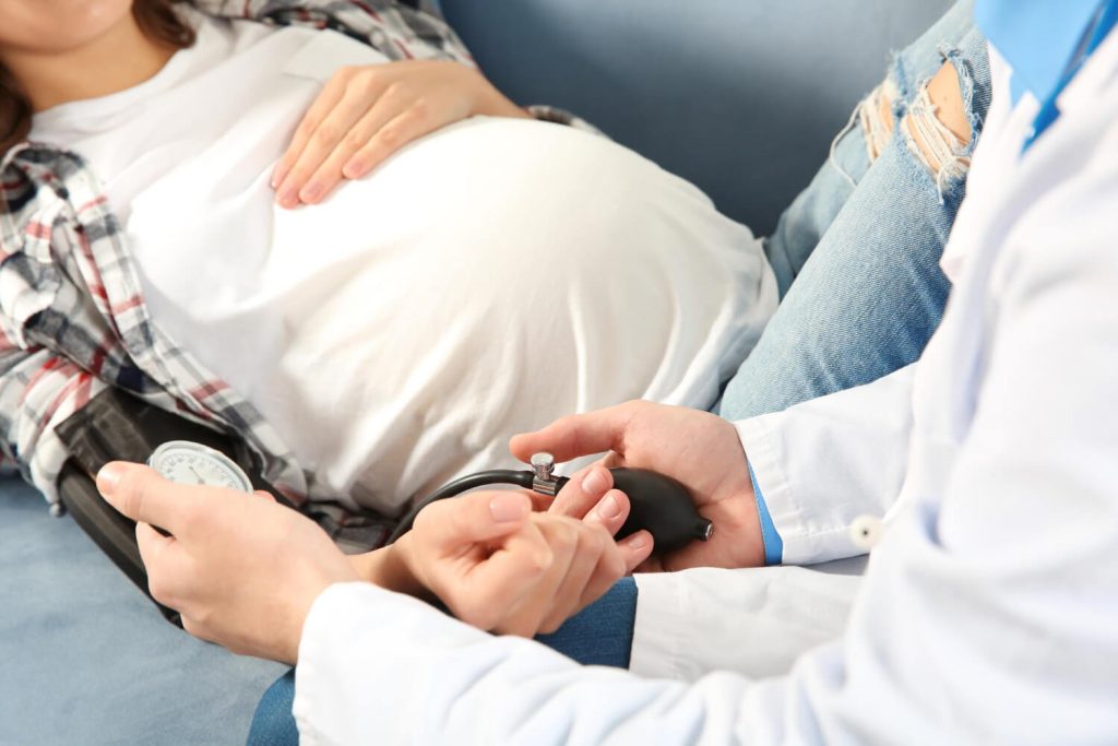 pregnant patient undergoing a doctor consultation