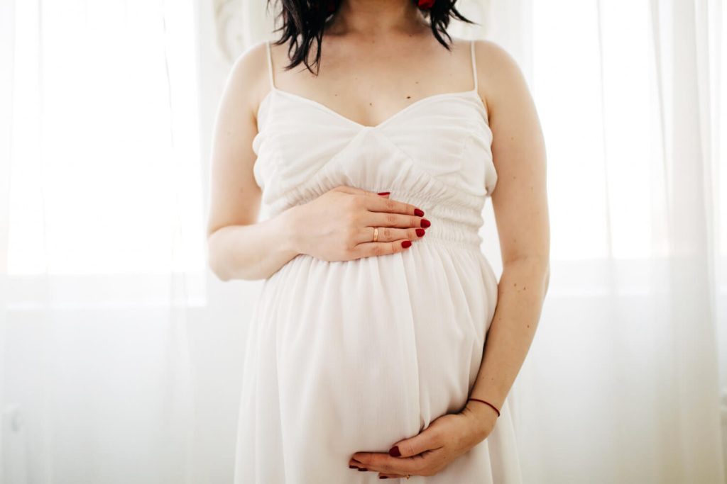 woman holding her belly