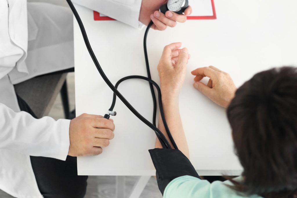 medical check-up - checking blood pressure