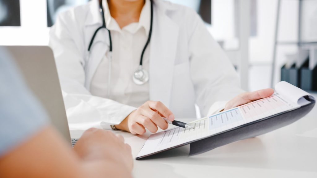 doctor explaining medical treatment to patient